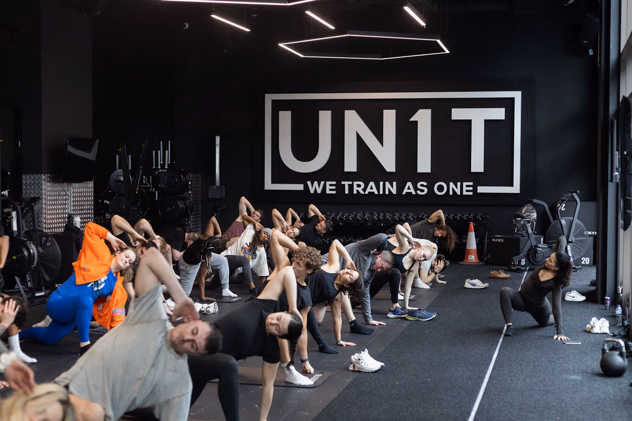 Group mobility session beneath the UN1T Nine Elms sign