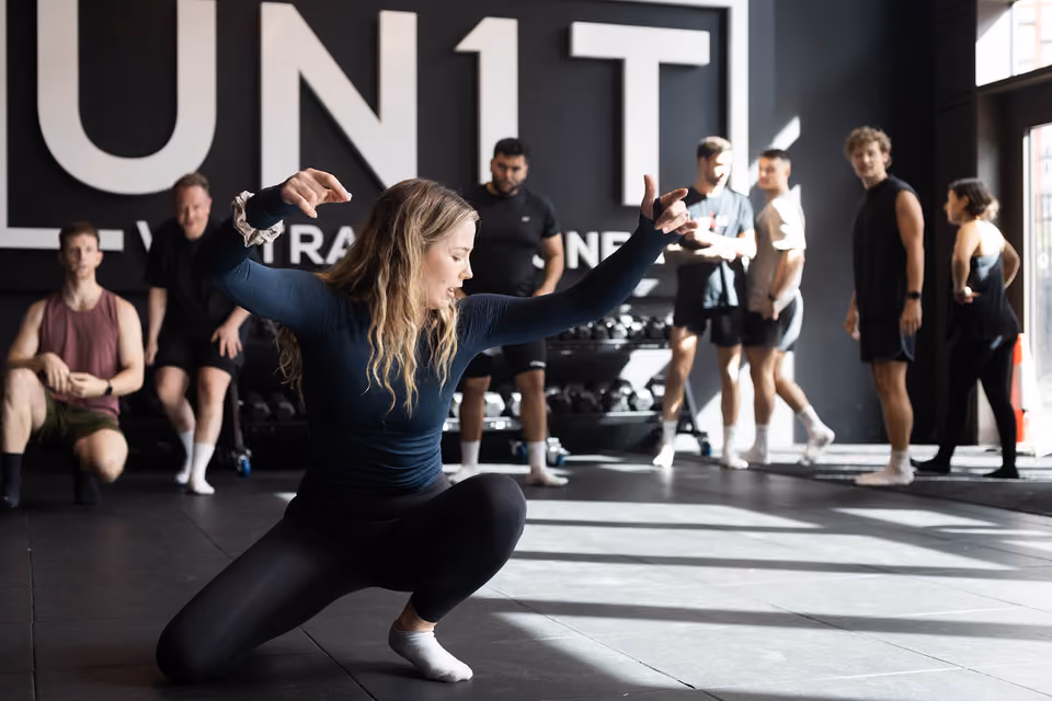 Coach leading an MXO group movement session